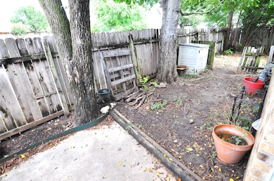 View of fenced backyard