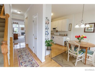 From the foyer, you see hardwood floors through th