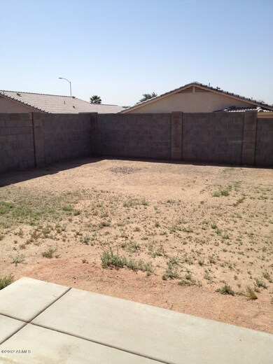 large back yard with extended concret