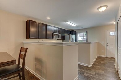 Welcoming entry leads you to open kitchen, dining area & great room. Fresh neutral paint throughout.