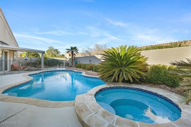 View of pool with an in ground hot tub, a patio ar
