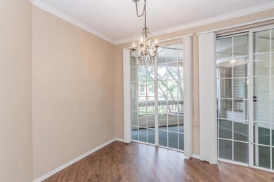 Wall of windows & glass door leads you to the cove