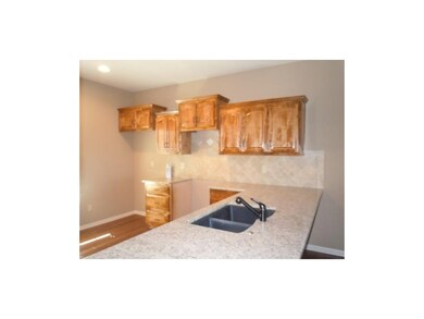 Kitchen with granite counter tops.