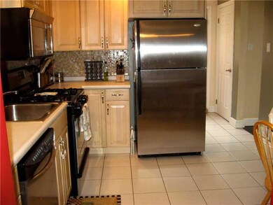 Kitchen. Around corner to right is a powder room &