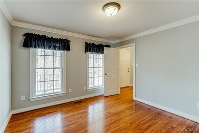 Formal Living Room with Hardwood Floors, Crown molding.