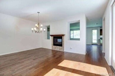 Formal Dining Room with through fireplace to Famil