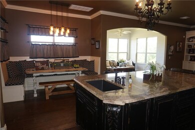 Center island & breakfast nook with built-in seati
