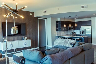 Wide open concept with kitchen spilling into living room and dining area
