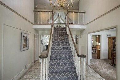 TILED ENTRY WAY, NEW CARPET ON STAIRS AND ON FIRST