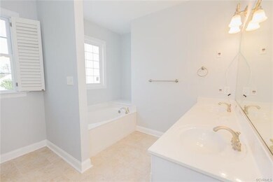 Some homes that claim to have a first floor master suite really just have a first floor bedroom.  Not this home!  This master bath has dual vanities, jetted tub, and tiled shower.