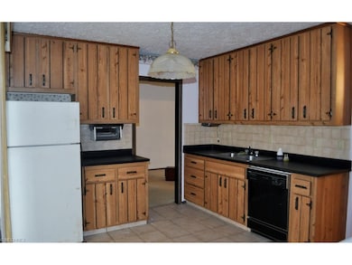 Kitchen with loads of storage is centrally located