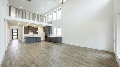 Unfurnished living room featuring light wood-type