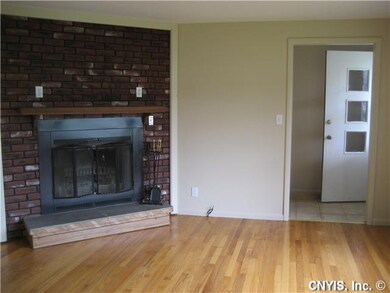 Living Room. This woodburning fireplace will cozy 