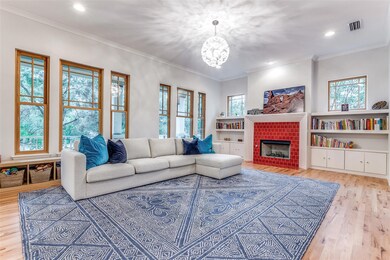 Large living room with grand fireplace and builit-