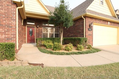 Entry and landscape. Front porch stretches to gara