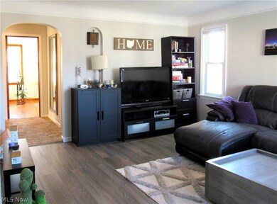 Living room with wood-type flooring