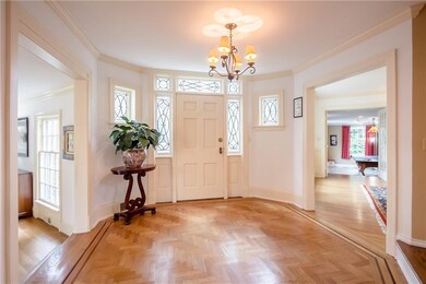 Foyer with leaded glass and herringbone red oak ha