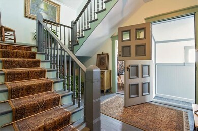 Grand stairway, wide foyer, Dutch-door entry- so l