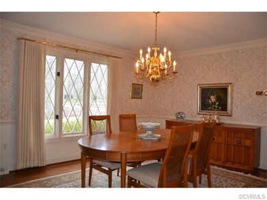 The dining room has hardwood floors, the tudor sty