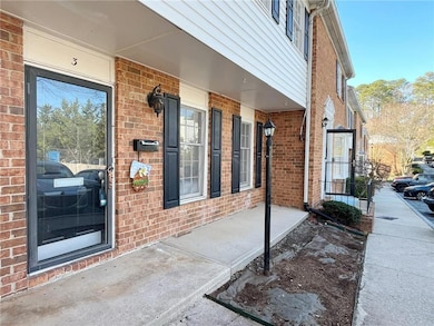View of exterior entry with a porch
