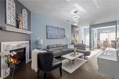 Living room with a textured ceiling, a high end fi