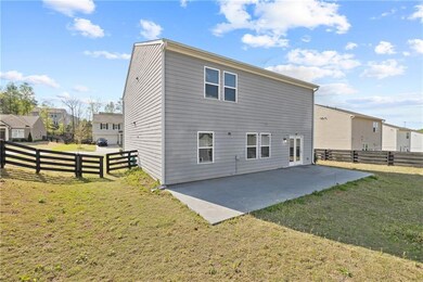 Back of property featuring a patio and a fenced backyard