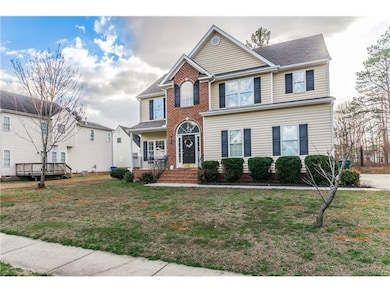 Sidewalk, brick and vinyl siding, side front porch