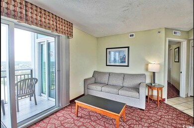 Tiled living room with baseboards, visible vents, 