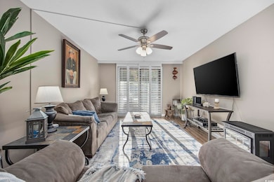 Living room with hardwood / wood-style floors and 