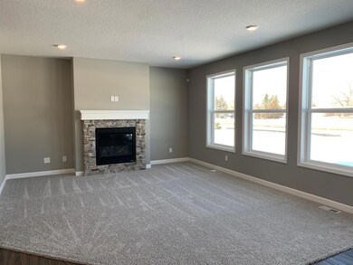 With three huge windows the living room will supply plenty of natural light.