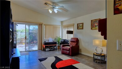 Tile flooring and high ceiling with light and fan