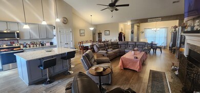 Living room featuring a fireplace, light wood-styl