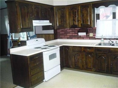 Kitchen. Kitchen with stove, refrigerator and dish