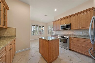 Kitchen featuring an island, granite counter tops 