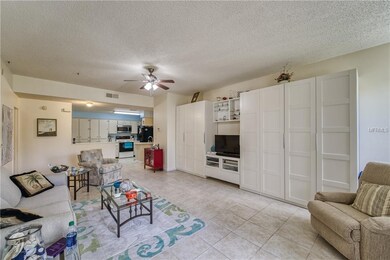 Spacious living room with tile floors and ample st