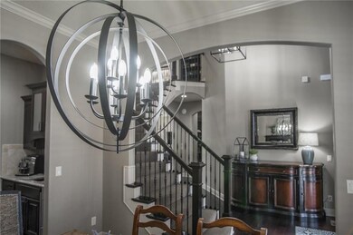 Dining room open to foyer area- and notice the  bu