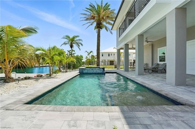 Seamless indoor-outdoor living with this sparkling pool, ideal for entertaining or quiet enjoyment - Virtually Edited Image