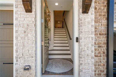 Front entrance - staircase with recessed lighting