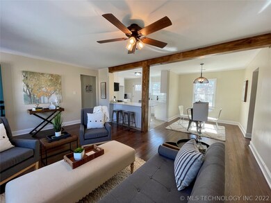 Refinished hardwoods, stained beam, open and brigh