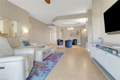 Living area with light tile patterned floors, a ra