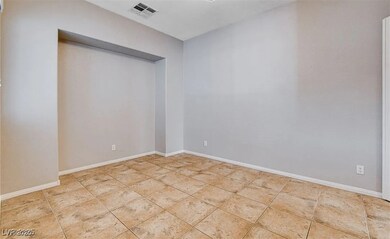 Empty room featuring baseboards