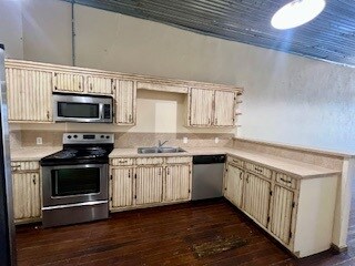 Kitchen featuring stainless steel appliances, crea