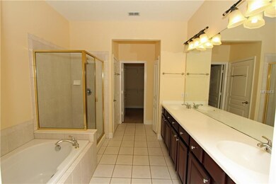 Master's bath featuring double sinks, garden tub, 