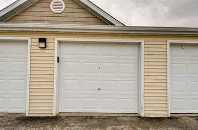 Single detached garage w/ opener located behind bu