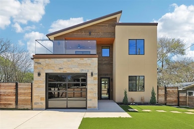 Rear view of house with stucco siding, stone sidi