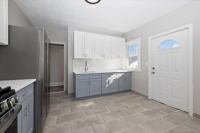 Large and brand new eat in kitchen, with quartz co