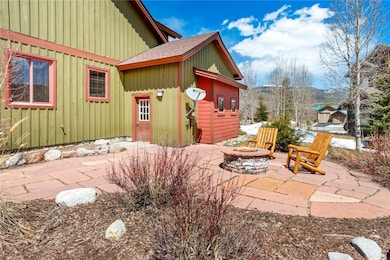 View of patio with a fire pit and a mountain view