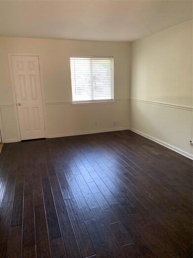 Empty room featuring dark wood-type flooring and 