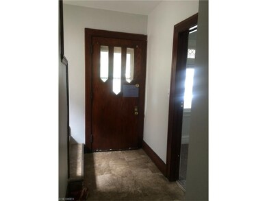Front entrance foyer connects to kitchen entrance 