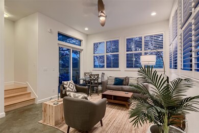 Sitting room featuring stairs, ceiling fan, reces